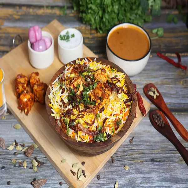Paneer Tikka Dum Biryani With Raita
